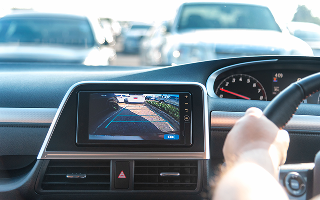 Rear View Monitor for car reverse system. Rear area image showing to driver by video camera at rear area to help for parking and prevent accident. Automotive safety technology equipment.