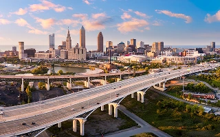 Aerial view of Cleveland, Ohio skyline and I90 interstate highway at sunset – Cleveland, cheap car insurance in Ohio
